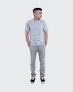 Young handsome man was posing wearing heather grey t-shirt short sleeve with mockup concept Royalty Free Stock Photo