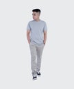 Young handsome man was posing wearing heather grey t-shirt short sleeve with mockup concept Royalty Free Stock Photo