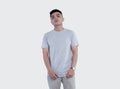 Young handsome man wearing heather grey t-shirt short sleeve Royalty Free Stock Photo