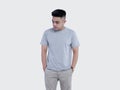 Young handsome man was posing wearing heather grey t-shirt short sleeve with mockup concept Royalty Free Stock Photo