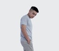 Young handsome man was posing wearing heather grey t-shirt short sleeve with mockup concept Royalty Free Stock Photo