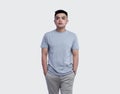 Young handsome man was posing wearing heather grey t-shirt short sleeve with mockup concept Royalty Free Stock Photo