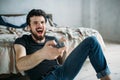 Young handsome man watching TV on a floor at home Royalty Free Stock Photo