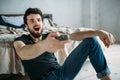 Young handsome man watching TV on a floor at home Royalty Free Stock Photo