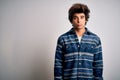 Young handsome man wearing casual shirt standing over isolated white background depressed and worry for distress, crying angry and Royalty Free Stock Photo