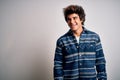 Young handsome man wearing casual shirt standing over isolated white background looking away to side with smile on face, natural Royalty Free Stock Photo