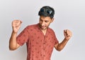 Young handsome man wearing casual summer clothes dancing happy and cheerful, smiling moving casual and confident listening to Royalty Free Stock Photo