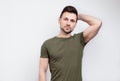 Young handsome man wearing casual t-shirt looking at the camera Royalty Free Stock Photo