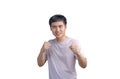 Young handsome man wearing casual t-shirt over white background. Punching fist to fight, aggressive and angry attack, threat and Royalty Free Stock Photo