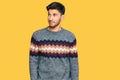 Young handsome man wearing casual winter sweater smiling looking to the side and staring away thinking Royalty Free Stock Photo