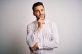 Young handsome man wearing elegant shirt standing over isolated white background looking confident at the camera smiling with Royalty Free Stock Photo