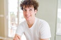 Young handsome man wearing white t-shirt smiling looking side and staring away thinking Royalty Free Stock Photo