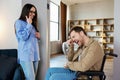 A young handsome man in a wheelchair reacts very emotionally and touchingly to the news that his girlfriend told him Royalty Free Stock Photo