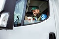 Handsome man working in towing service and driving his truck