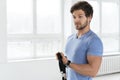 Young man during workout with a resistance bands in the gym Royalty Free Stock Photo