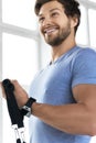 Young man during workout with a resistance bands in the gym Royalty Free Stock Photo