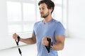 Young man during workout with a resistance bands in the gym Royalty Free Stock Photo