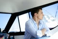 Young handsome man on a yacht boat interior Royalty Free Stock Photo
