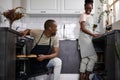 Man opened oven and look at wife Royalty Free Stock Photo