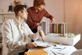 Young handsome men working on architectural project, planning construction Royalty Free Stock Photo