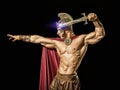 Young muscular man posing in roman gladiator costume Royalty Free Stock Photo