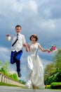 Young and handsome newlyweds on a walk in the park Royalty Free Stock Photo