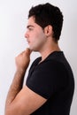 Young handsome Persian man against white background Royalty Free Stock Photo
