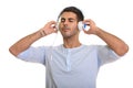 Young handsome Persian man listening to music with eyes closed