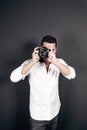 Young handsome photographer with beard and mustache studio portrait