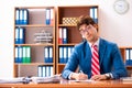 The young handsome politician sitting in office Royalty Free Stock Photo