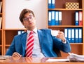 Young handsome politician sitting in office Royalty Free Stock Photo