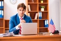 The young handsome politician sitting in office