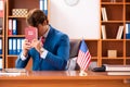 The young handsome politician sitting in office