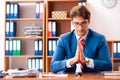 The young handsome politician sitting in office Royalty Free Stock Photo