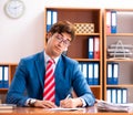 Young handsome politician sitting in office Royalty Free Stock Photo