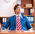 Young handsome politician sitting in office Royalty Free Stock Photo