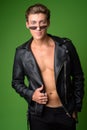 Young handsome rebellious man wearing leather jacket Royalty Free Stock Photo