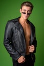 Young handsome rebellious man wearing leather jacket Royalty Free Stock Photo