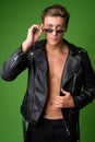 Young handsome rebellious man wearing leather jacket Royalty Free Stock Photo