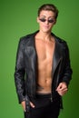 Young handsome rebellious man wearing leather jacket Royalty Free Stock Photo