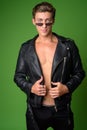 Young handsome rebellious man wearing leather jacket Royalty Free Stock Photo