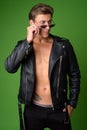 Young handsome rebellious man wearing leather jacket Royalty Free Stock Photo