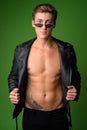 Young handsome rebellious man wearing leather jacket Royalty Free Stock Photo