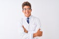 Young handsome sciencist man wearing glasses and coat over isolated white background happy face smiling with crossed arms looking Royalty Free Stock Photo