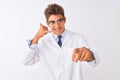 Young handsome sciencist man wearing glasses and coat over isolated white background smiling doing talking on the telephone Royalty Free Stock Photo