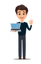 Young handsome smiling businessman in smart casual clothes holding laptop and showing OK gesture