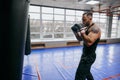 Young handsome strong avtive man exercising in the gym