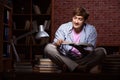 The young handsome student preparing for exams at night Royalty Free Stock Photo