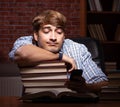 Young handsome student preparing for exams at night Royalty Free Stock Photo