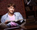 Young handsome student preparing for exams at night Royalty Free Stock Photo